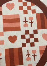 Patterned fabric with hearts, flowers, and checkered squares in brown and pink tones.