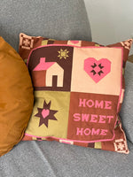 Quilted pillow with text 'Home Sweet Home'